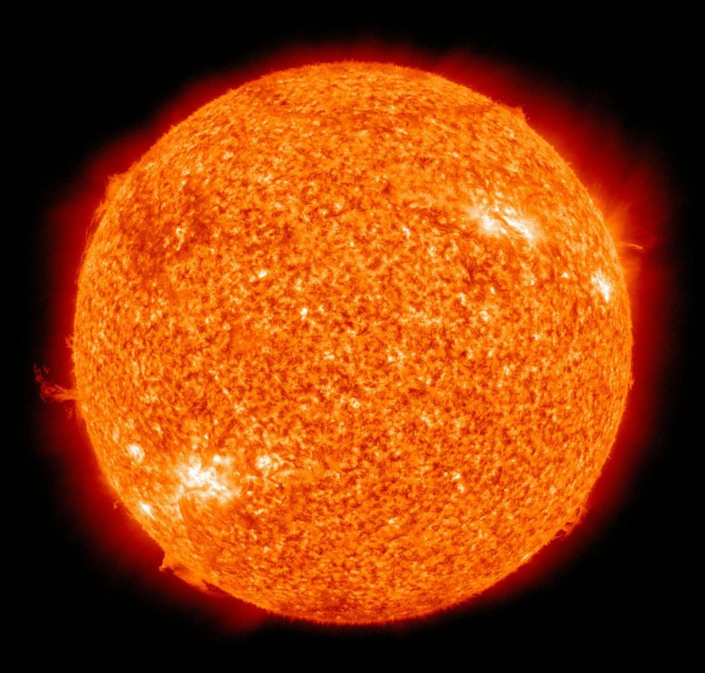 Detailed image of the sun showcasing its fiery surface and glowing edges.